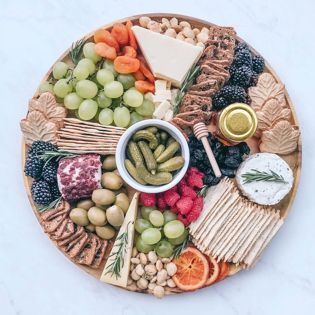 First Thanksgiving grazing board out for delivery today This one is vegetarian heavier on the cheese fresh fruit olives dried fruits. peep those maple leaf cookies How cute are those @traderjoeslist Can