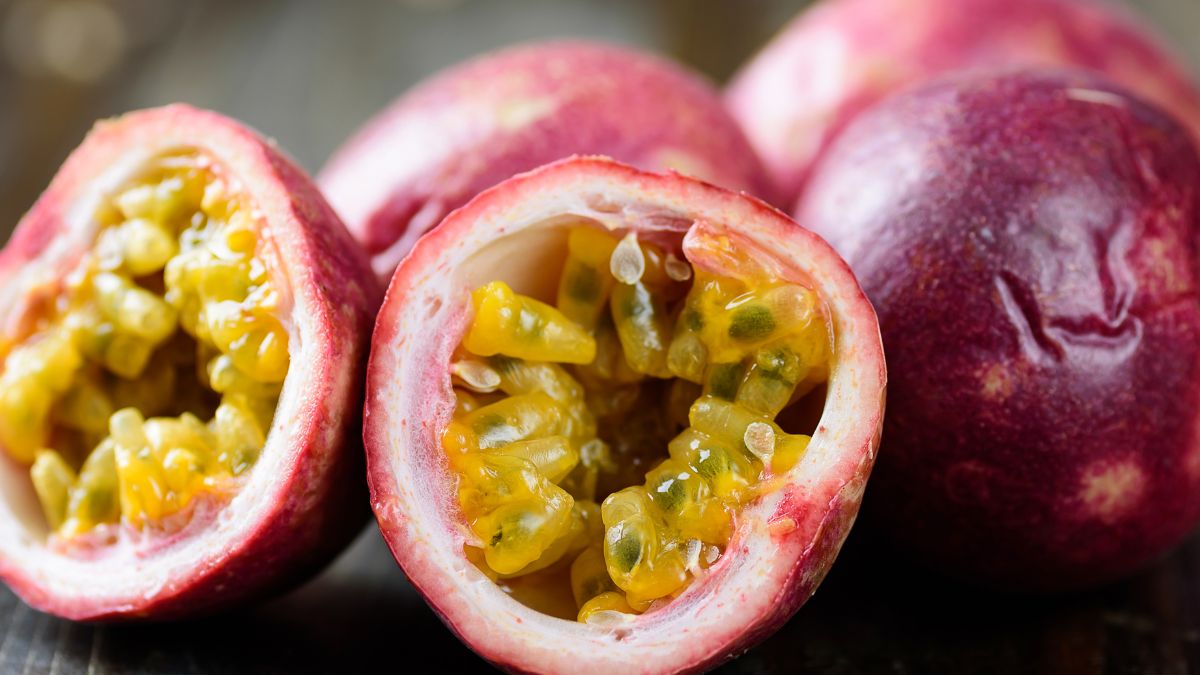 Passion fruit, halved, on a table